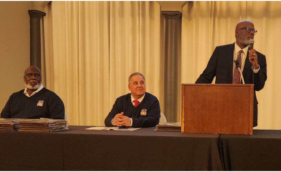 Hall of Fame event photograph featuring the master of ceremonies and board representatives